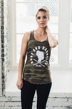 Woman wearing a camo athletic tank with black leggings