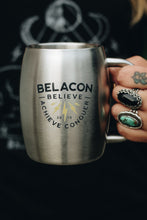 stainless steel mug in woman's hand