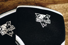 black knee sleeves with a wolf logo saying wolff elite