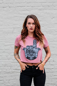 woman wearing a cropped tee with a hamsa graphic design