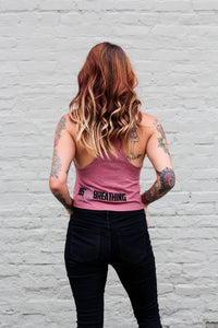 back of woman wearing a mauve crop top tank 