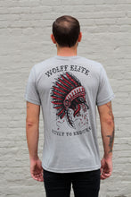 man wearing a shirt with wolf and headdress