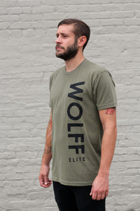 man wearing an olive athletic tee with side graphic 