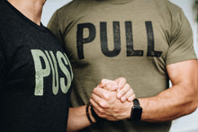 Two men wearing opposite graphic tees