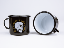 black enamel mug with white handle and inside