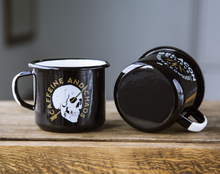 black enamel mugs sitting on wood table